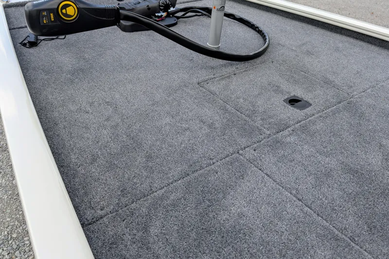 Slide: The Image of 2026 Tracker Pro 170 boat deck with gray carpet and trolling motor. - 7