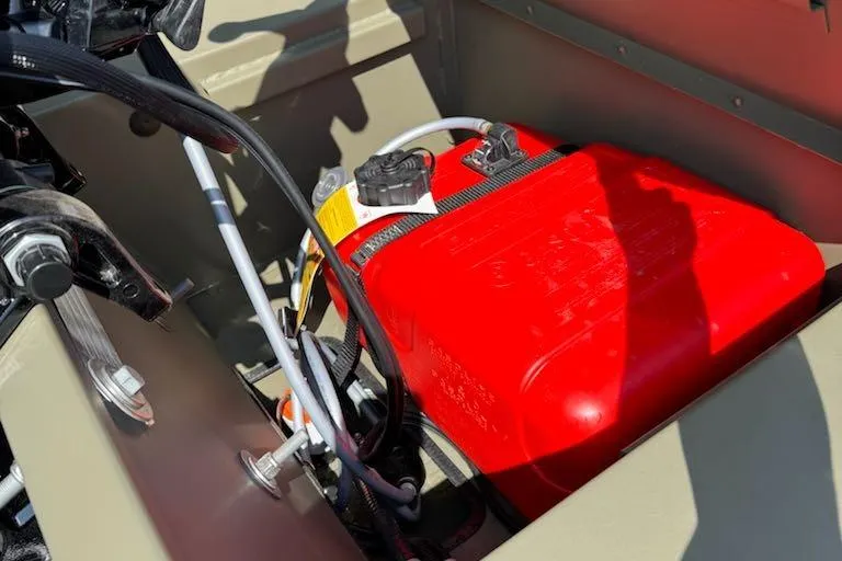 Slide: The Image of Red battery compartment in 2026 Tracker Grizzly 1654 T Sportsman boat. - 5