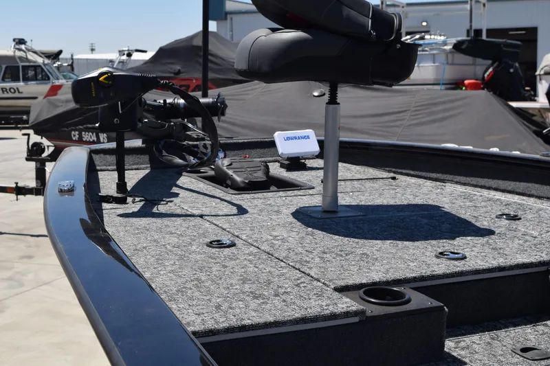 Slide: The Image of 2026 Tracker Pro Team 175 boat deck with seating and navigation equipment. - 2