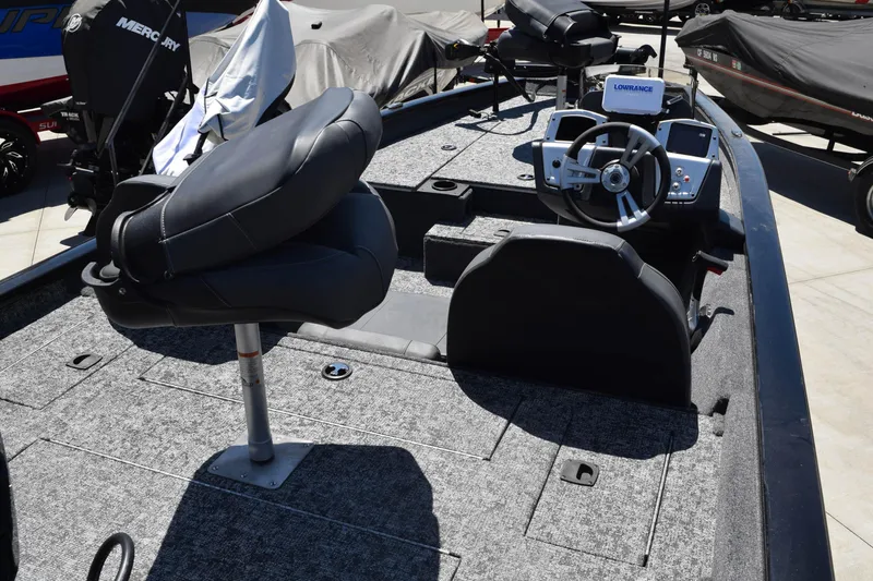 Slide: The Image of 2026 Tracker Pro Team 175 boat interior with steering console and seating. - 4