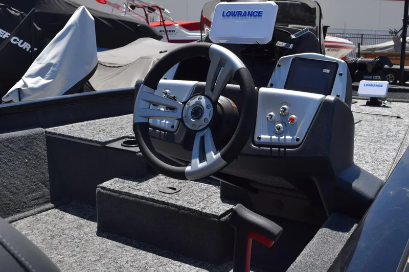 Slide: The Image of 2026 Tracker Pro Team 175 boat dashboard with steering wheel and Lowrance electronics. - 5