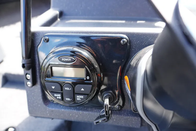 Slide: The Image of Control panel of 2026 Tracker Targa V-18 WT boat with power and volume buttons. - 11
