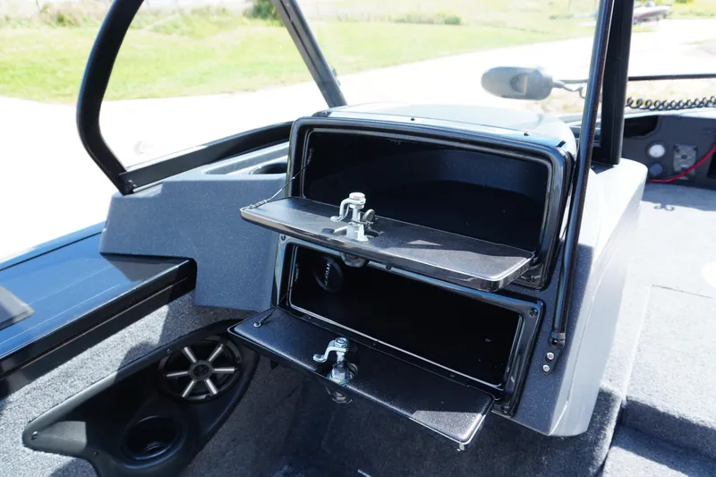 Slide: The Image of 2026 Tracker Targa V-18 WT boat interior with open storage compartments. - 12