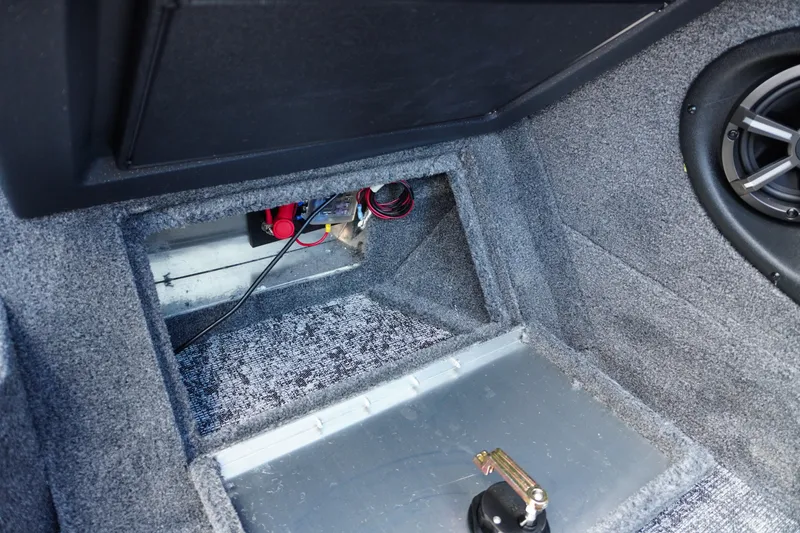 Slide: The Image of Interior view of 2026 Tracker Targa V-18 WT boat, showcasing wiring and speaker setup. - 14