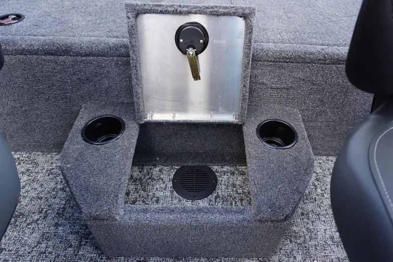 Slide: The Image of Interior of 2026 Tracker Targa V-18 WT boat with cup holders and storage compartment. - 18