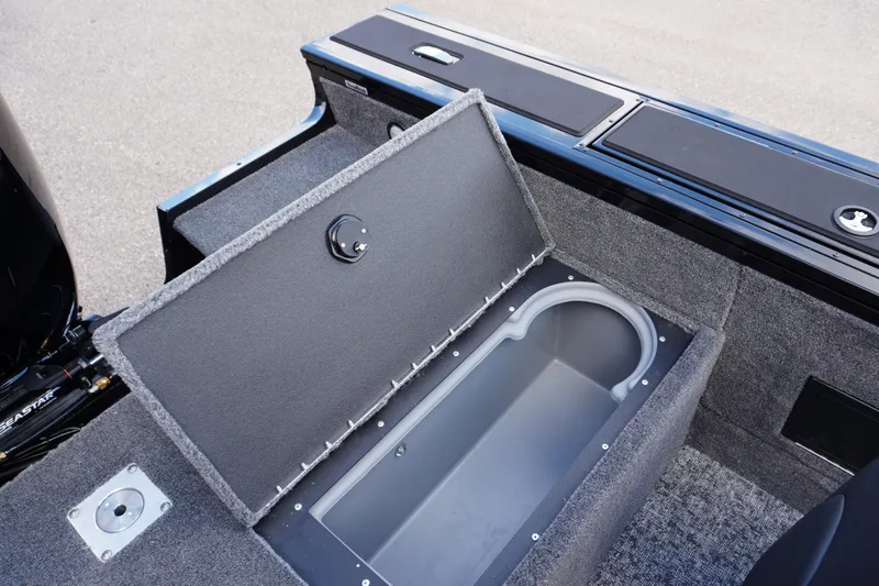 Slide: The Image of 2026 Tracker Targa V-18 WT boat with open storage compartment. - 21