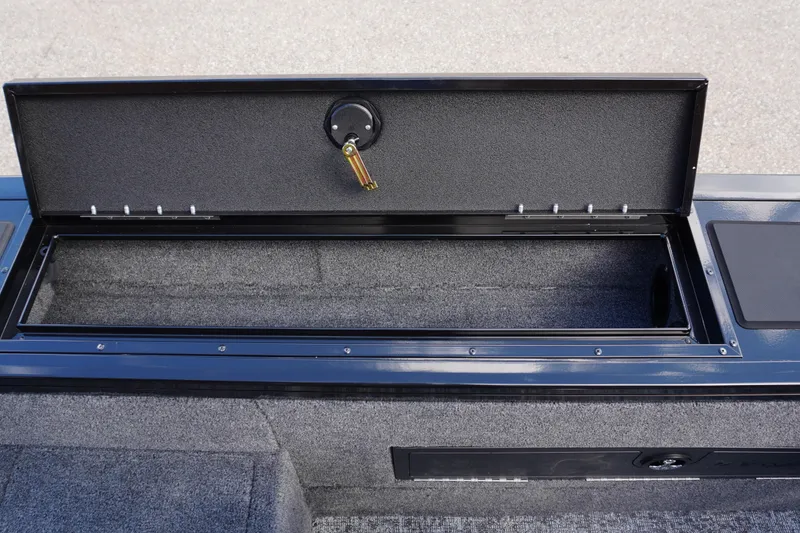 Slide: The Image of Open storage compartment in 2026 Tracker Targa V-18 WT boat, showcasing interior space. - 24
