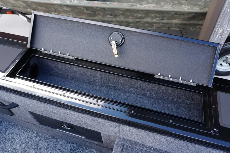 Slide: The Image of Open storage compartment in 2026 Tracker Targa V-18 WT boat. - 25