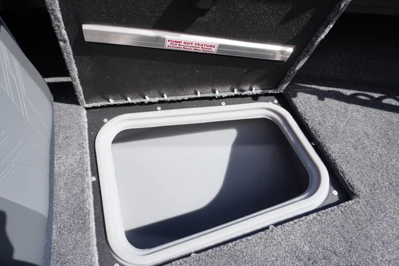 Slide: The Image of Open storage compartment in 2026 Tracker Targa V-18 WT boat. - 6