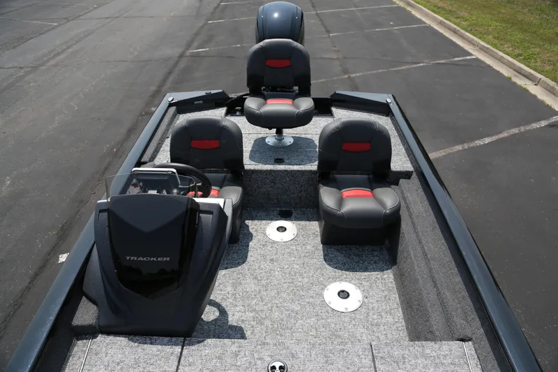 Slide: The Image of 2026 Tracker Pro Team 175 Crappie Edition boat with seating and steering console. - 3