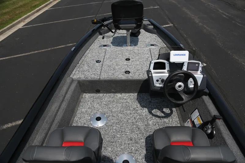 Slide: The Image of 2026 Tracker Pro Team 175 Crappie Edition boat interior with steering console and seating. - 5