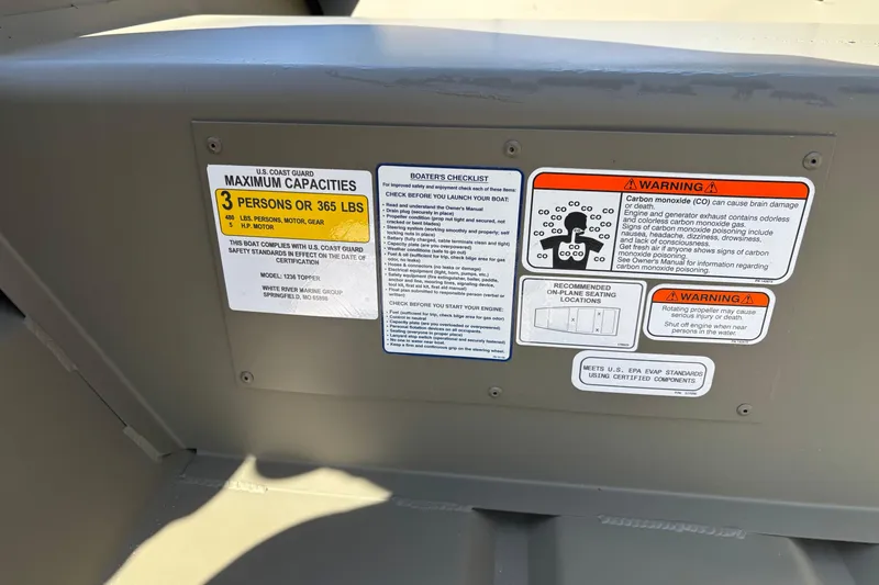 Slide: The Image of Safety and capacity labels on 2026 Tracker Grizzly 12 Jon boat interior. - 3