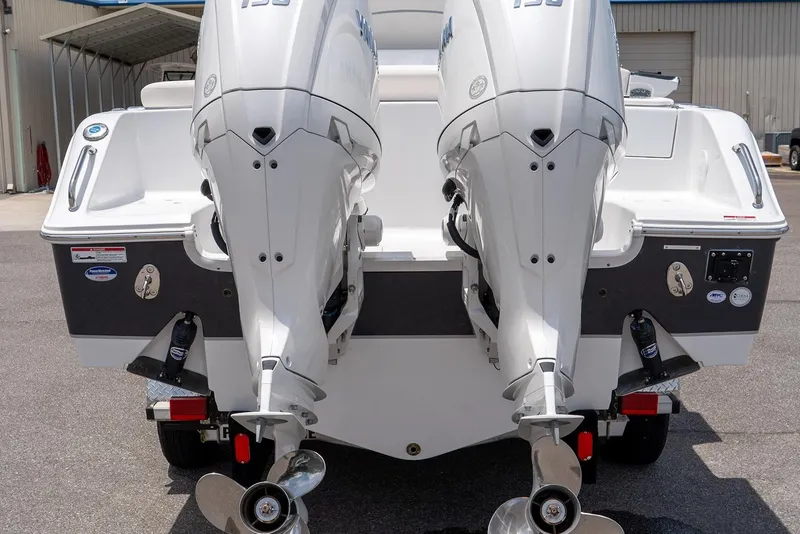 Slide: The Image of 2026 Sea Hunt Ultra 265 SE boat with dual outboard engines, rear view. - 15