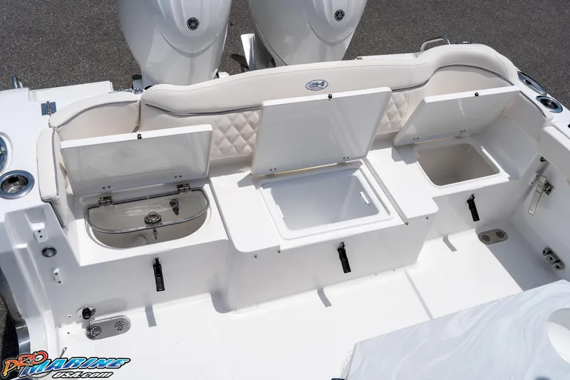 Slide: The Image of 2026 Sea Hunt Ultra 265 SE boat interior with open storage compartments and seating. - 19