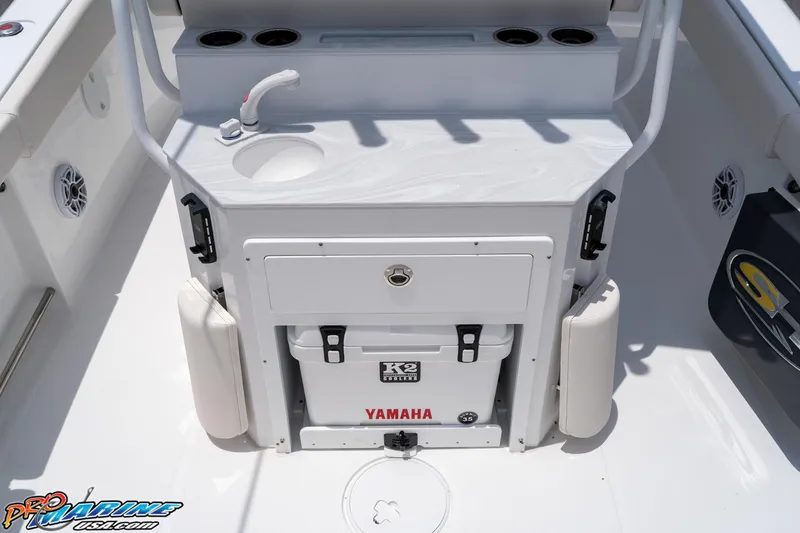 Slide: The Image of 2026 Sea Hunt Ultra 265 SE boat interior with sink and storage area. - 21