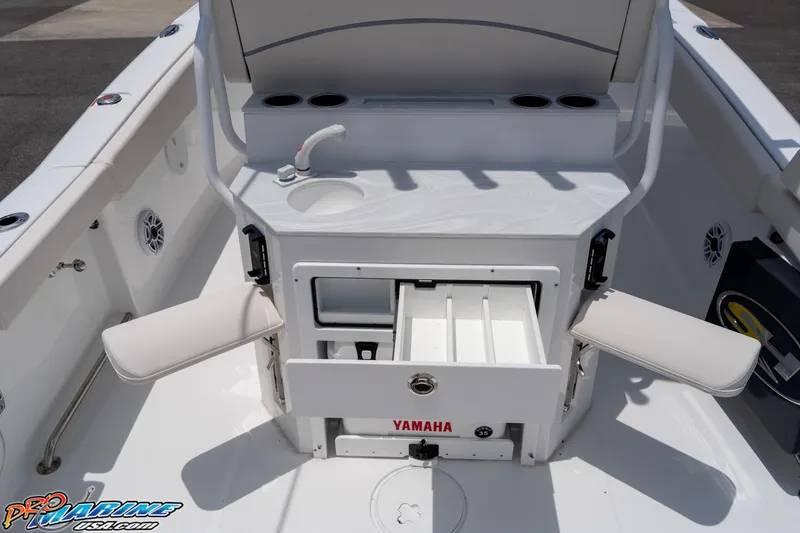 Slide: The Image of 2026 Sea Hunt Ultra 265 SE boat interior with storage compartments and seating. - 22
