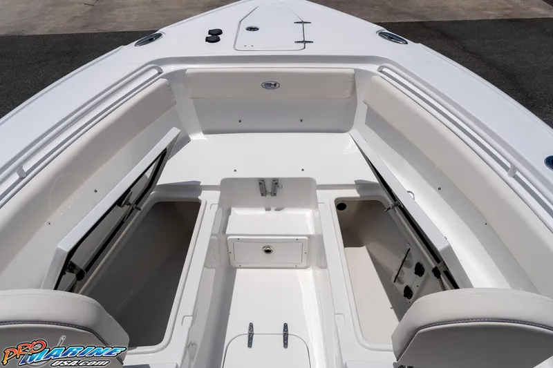 Slide: The Image of 2026 Sea Hunt Ultra 265 SE boat interior with open storage compartments and seating. - 31