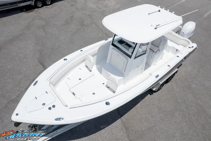 Slide: The Image of 2026 Sea Hunt Ultra 265 SE boat, aerial view, white exterior, spacious deck, modern design. - 4
