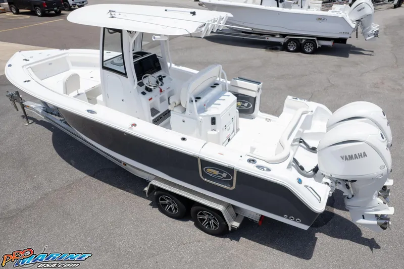 Slide: The Image of 2026 Sea Hunt Ultra 265 SE boat with dual Yamaha engines on a trailer. - 5