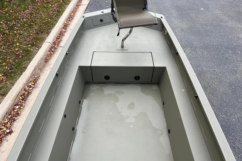 Slide: The Image of 2026 Tracker Grizzly 1650 T Prairie Wings Edition boat interior with swivel seat. - 5