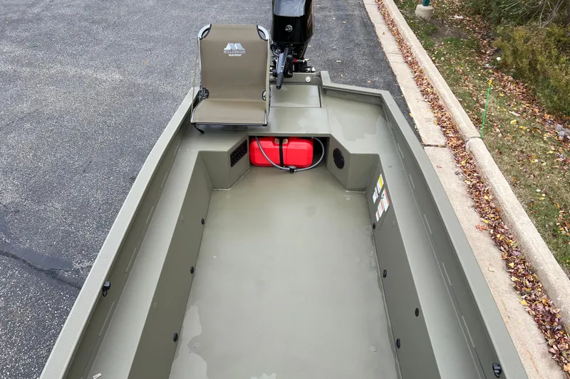 Slide: The Image of 2026 Tracker Grizzly 1650 T Prairie Wings Edition boat interior with seating and storage. - 6