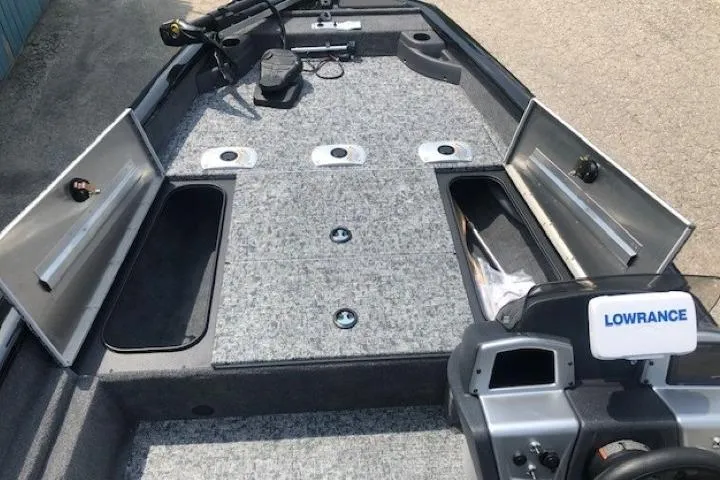 Slide: The Image of 2026 Tracker Pro Team 175 Crappie Edition boat interior with storage compartments and Lowrance equipment. - 10