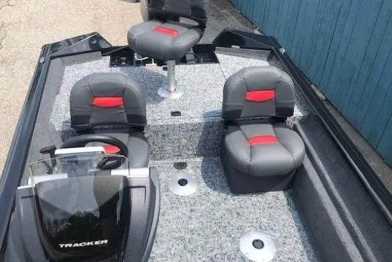Slide: The Image of 2026 Tracker Pro Team 175 Crappie Edition boat interior with three seats and steering console. - 14