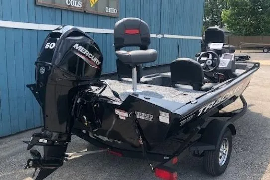 Slide: The Image of 2026 Tracker Pro Team 175 Crappie Edition boat with Mercury 50 engine, parked outdoors. - 5