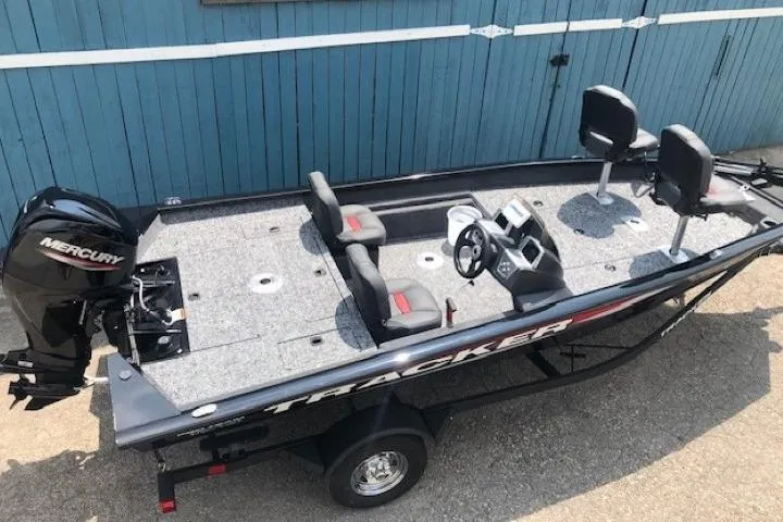 Slide: The Image of 2026 Tracker Pro Team 175 Crappie Edition boat with Mercury engine, parked on trailer. - 7