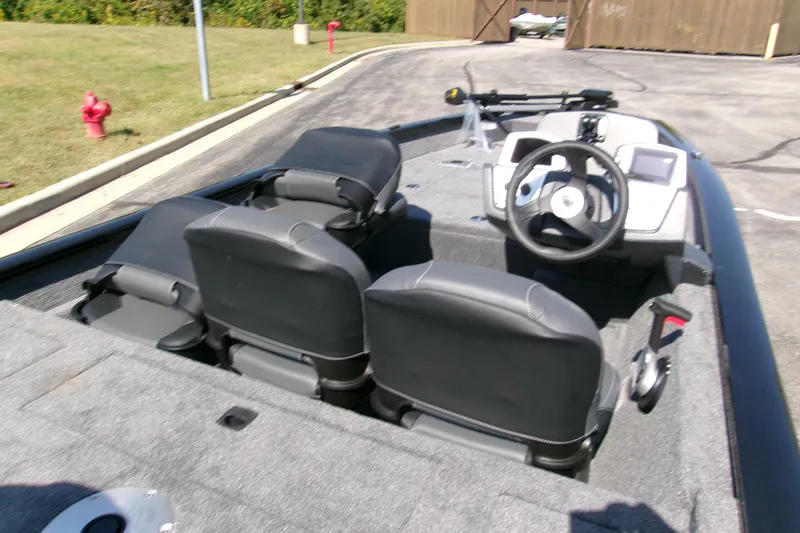 Slide: The Image of 2026 Tracker Pro Team 175 Crappie Edition boat interior with steering wheel and seating. - 4