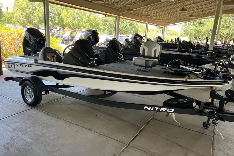 The Image of 2026 Nitro Z17 boat on trailer, parked under a canopy. - 0