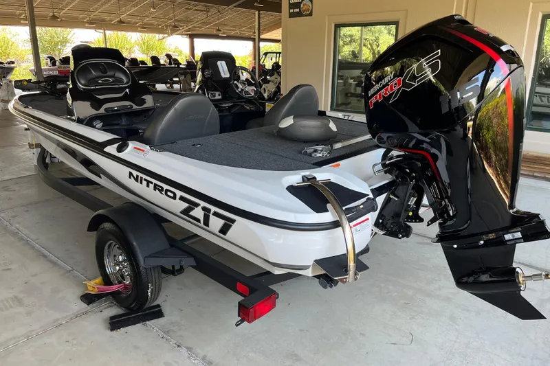 Slide: The Image of 2026 Nitro Z17 boat with Mercury Pro XS engine, displayed in a showroom. - 2