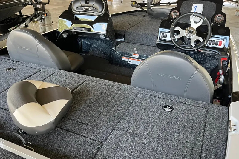 Slide: The Image of 2026 Nitro Z17 boat interior with steering wheel and cushioned seats. - 7