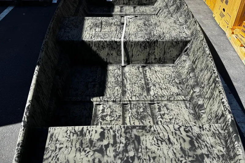 Slide: The Image of 2026 Tracker Grizzly 15 Jon boat with camouflage interior design. - 3