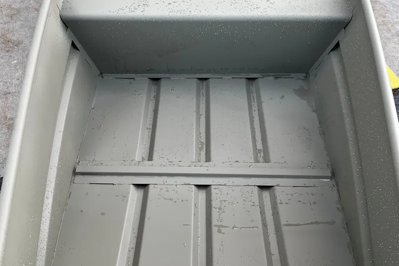 Slide: The Image of Interior view of 2026 Tracker Grizzly 14 Jon boat with water droplets. - 3