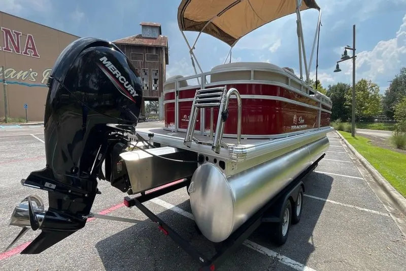 Slide: The Image of 2025 Sun Tracker Party Barge 24 DLX pontoon boat with Mercury outboard motor. - 3