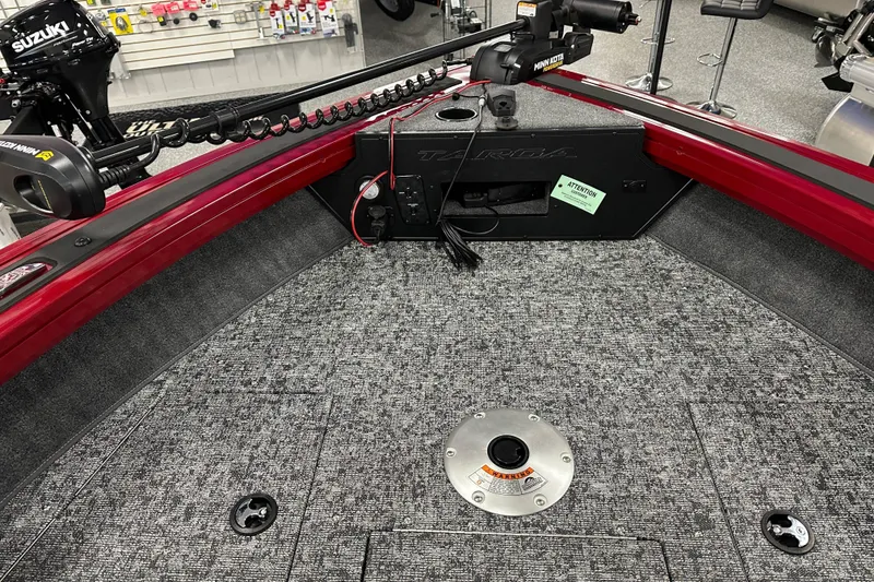 Slide: The Image of 2026 Tracker Targa V-18 WT boat interior with seating and steering console. - 11