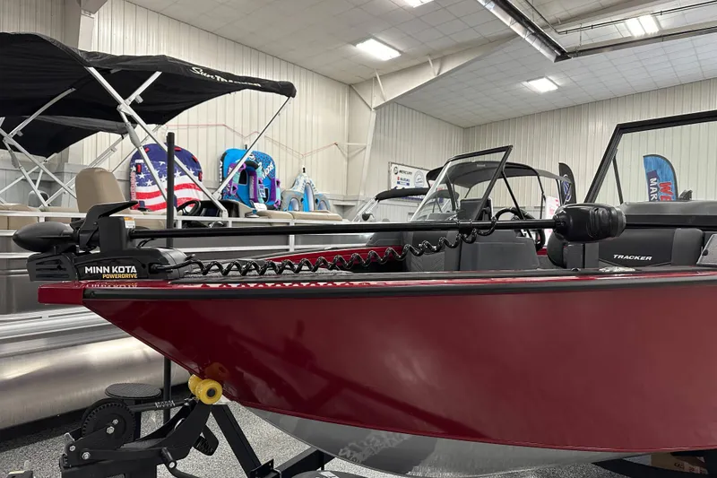 Slide: The Image of 2026 Tracker Targa V-18 WT boat with Minn Kota trolling motor in showroom. - 7