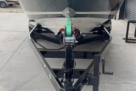 Slide: The Image of Front view of a 2000 Cobalt 252 boat on a trailer in a garage. - 5