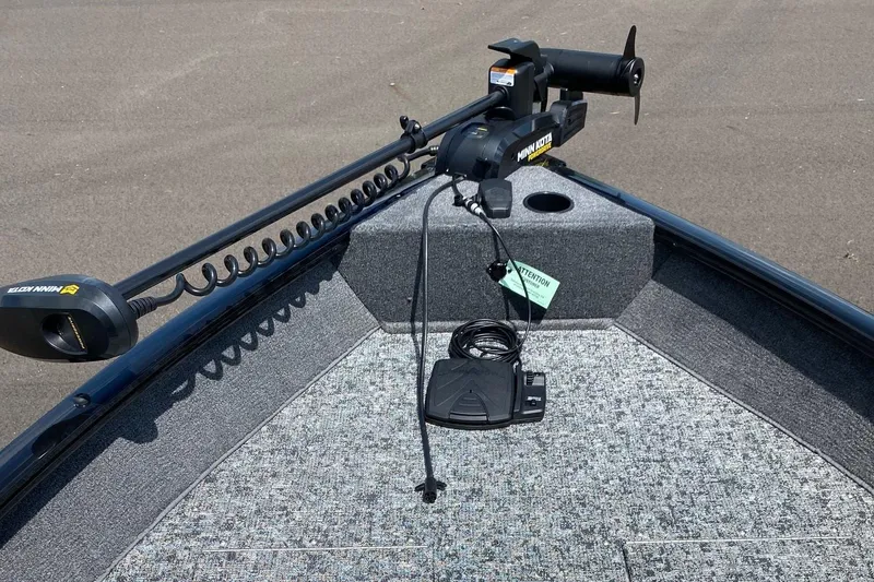 Slide: The Image of 2026 Tracker Pro Guide V-16 SC boat with Minn Kota trolling motor on deck. - 3