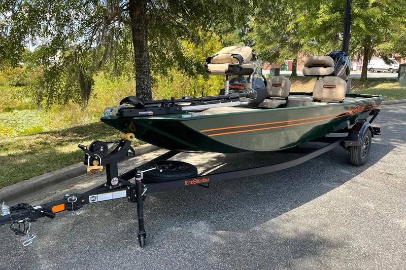 The Image of 2026 Tracker Bass Tracker Classic Limited boat on trailer, parked outdoors. - 1