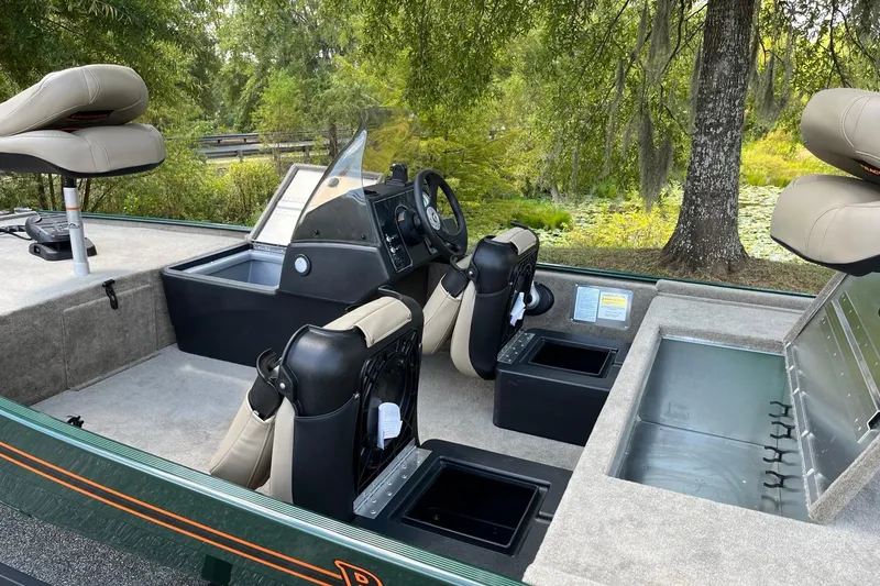 Slide: The Image of 2026 Tracker Bass Tracker Classic Limited boat interior with seating and storage compartments. - 8