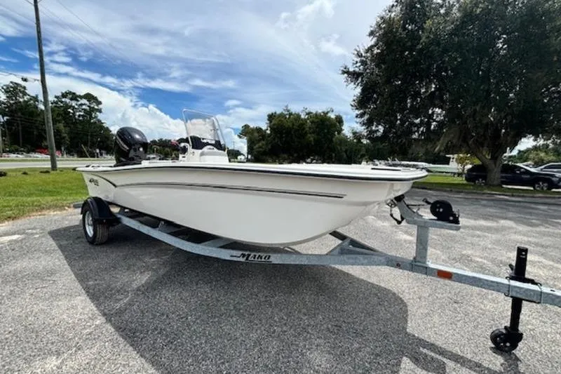 Slide: The Image of 2026 Mako Pro Skiff 17 CC boat on trailer, parked outdoors. - 3