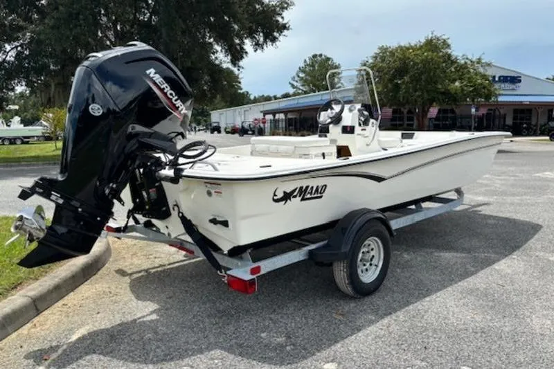Slide: The Image of 2026 Mako Pro Skiff 17 CC boat on trailer with Mercury outboard motor. - 5