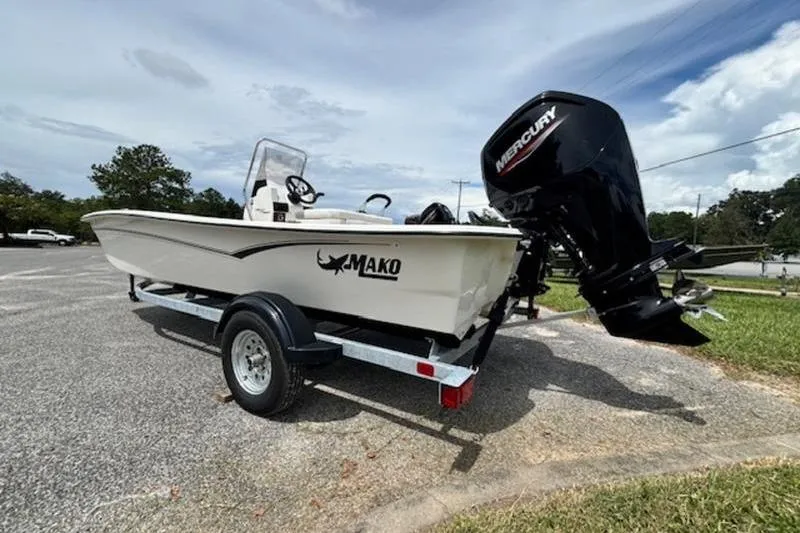 Slide: The Image of 2026 Mako Pro Skiff 17 CC boat on trailer with Mercury outboard motor. - 7