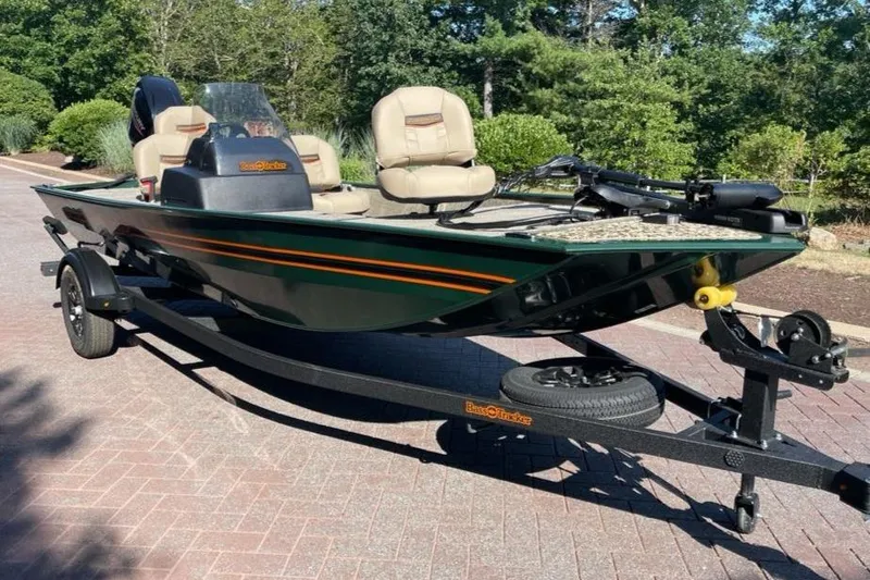 Slide: The Image of 2026 Tracker Bass Tracker Classic Limited boat on trailer, parked outdoors. - 2