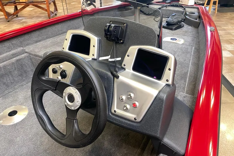 Slide: The Image of 2026 Tracker Pro Team 175 Crappie Edition boat dashboard with steering wheel and controls. - 10