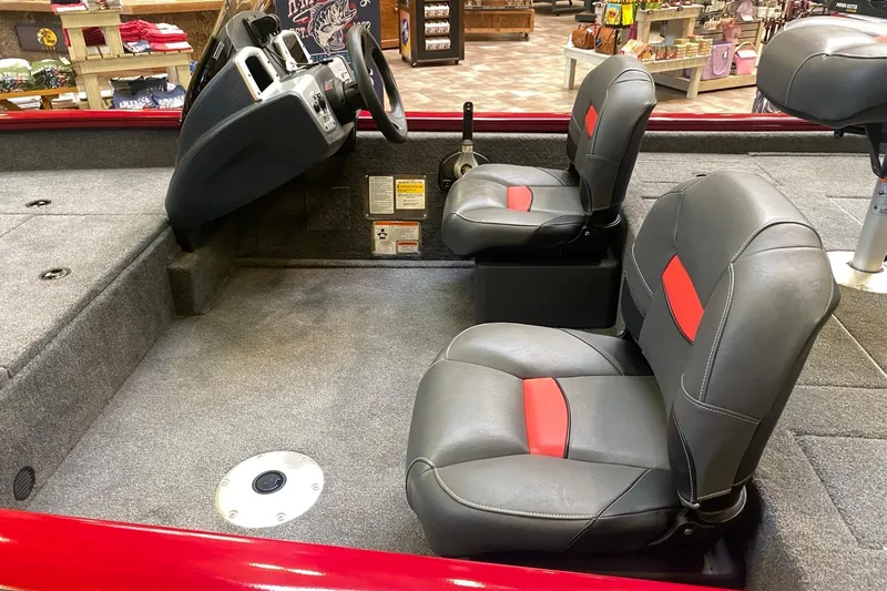 Slide: The Image of 2026 Tracker Pro Team 175 Crappie Edition boat interior with gray and red seats. - 12