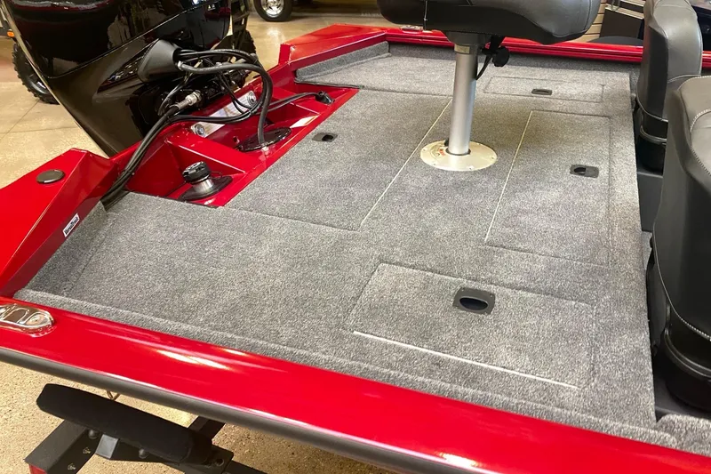 Slide: The Image of 2026 Tracker Pro Team 175 Crappie Edition boat interior with gray carpet and seating. - 13