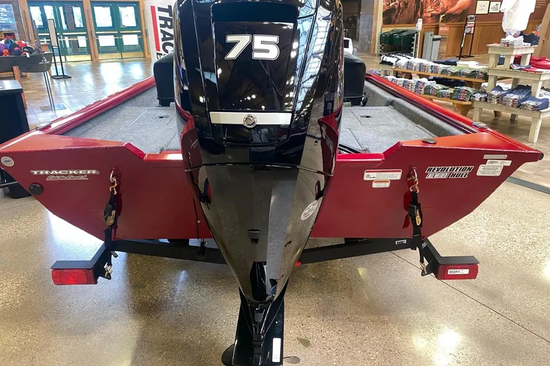 Slide: The Image of 2026 Tracker Pro Team 175 Crappie Edition boat with 75 HP engine displayed indoors. - 15